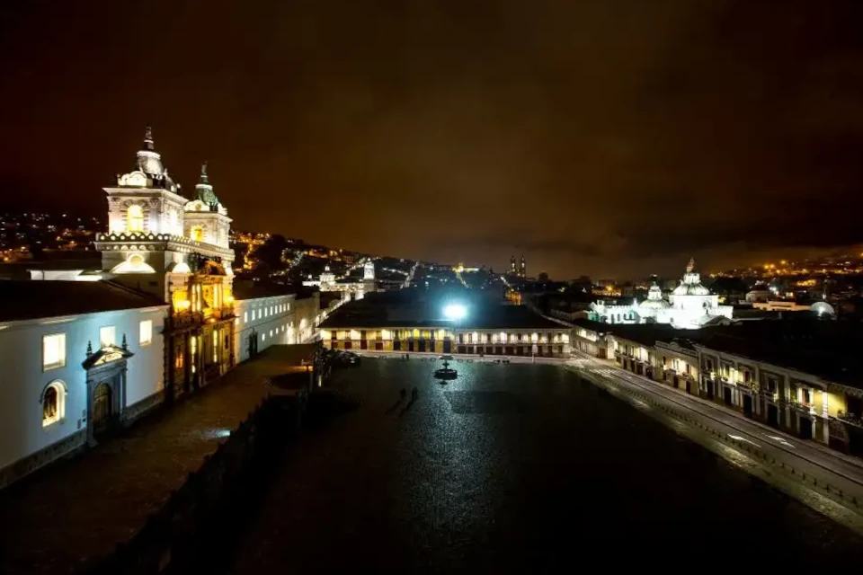 Night view from Casa Gangotena Boutique Hotel overlooking Quito's illuminated skyline.