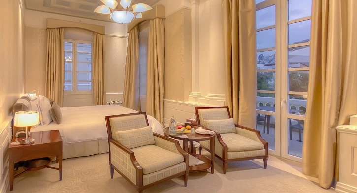 Elegant room at Casa Gangotena, Boutique Hotel in Quito, with expansive windows and serene ambiance.