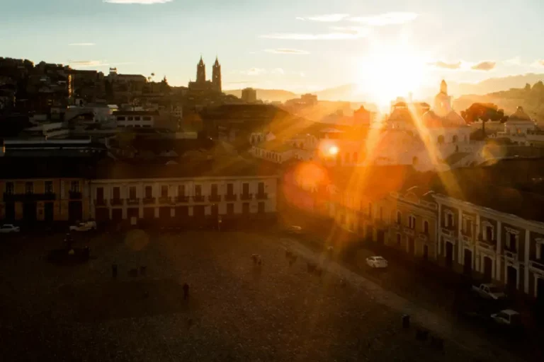 Sunrise illuminating Quito's skyline as seen from Casa Gangotena, a premier Boutique Hotel in the heart of the city.