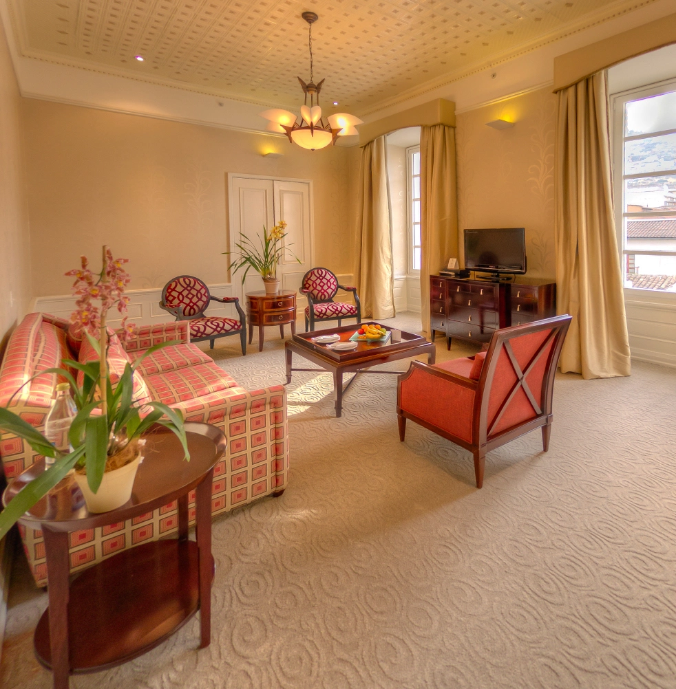 Elegant suite at Casa Gangotena, Hotel Quito with sophisticated furnishings.