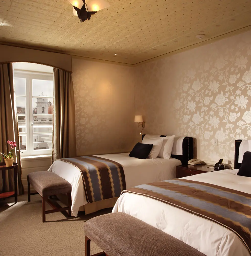 Chic luxury room in Casa Gangotena, Hotel Quito with city view.